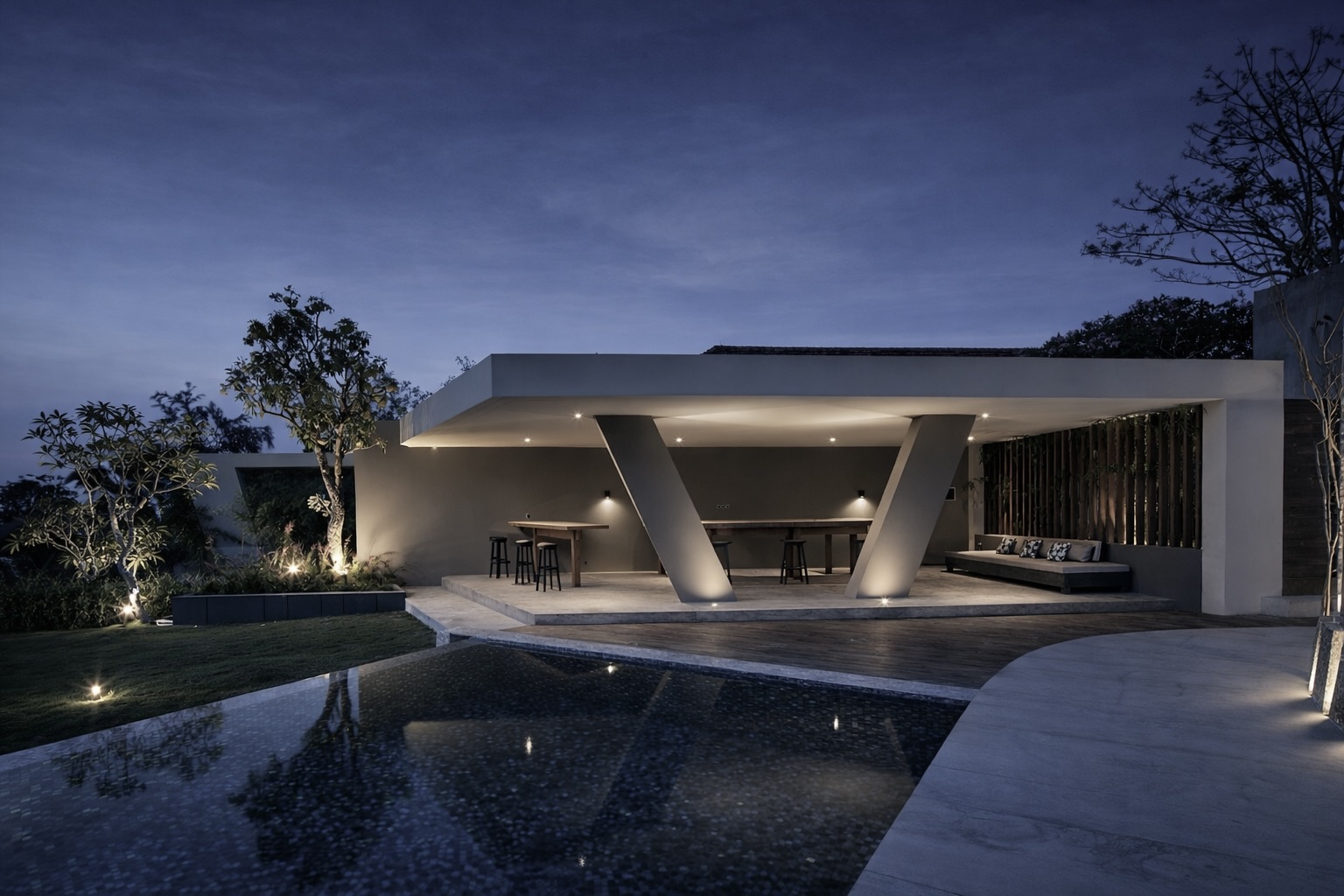 Twilight pavilion — angled columns under cantilever roof, warm interior lighting, pool reflection