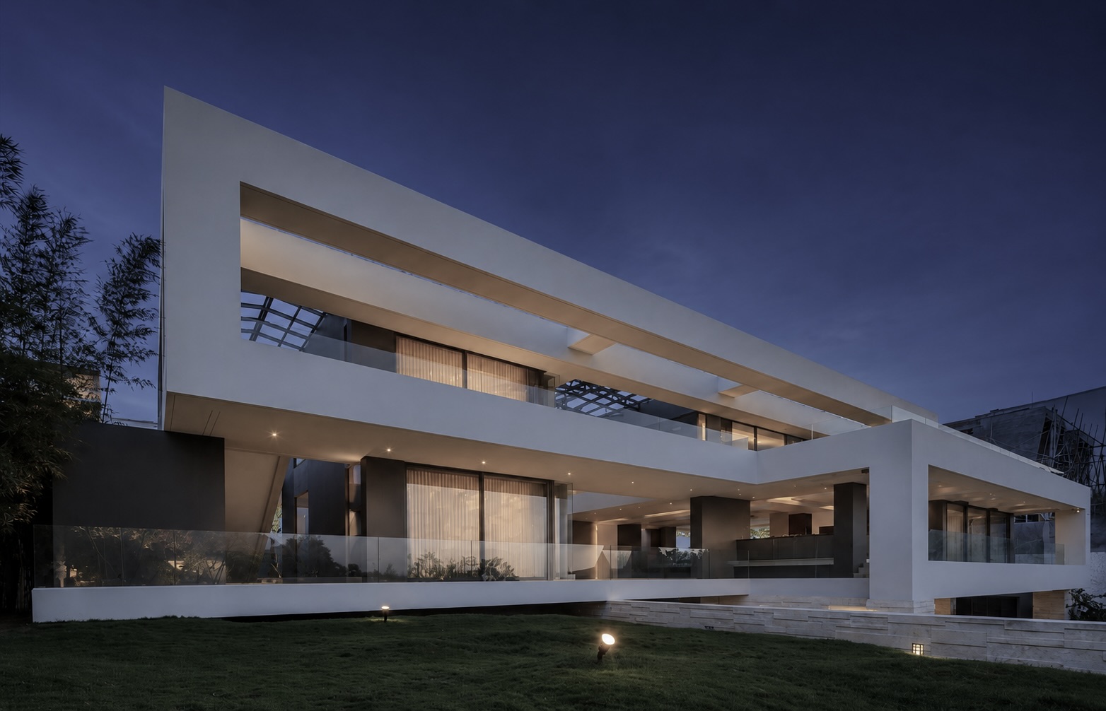 Populaire residence — cantilevered white wedge form against tropical daylight