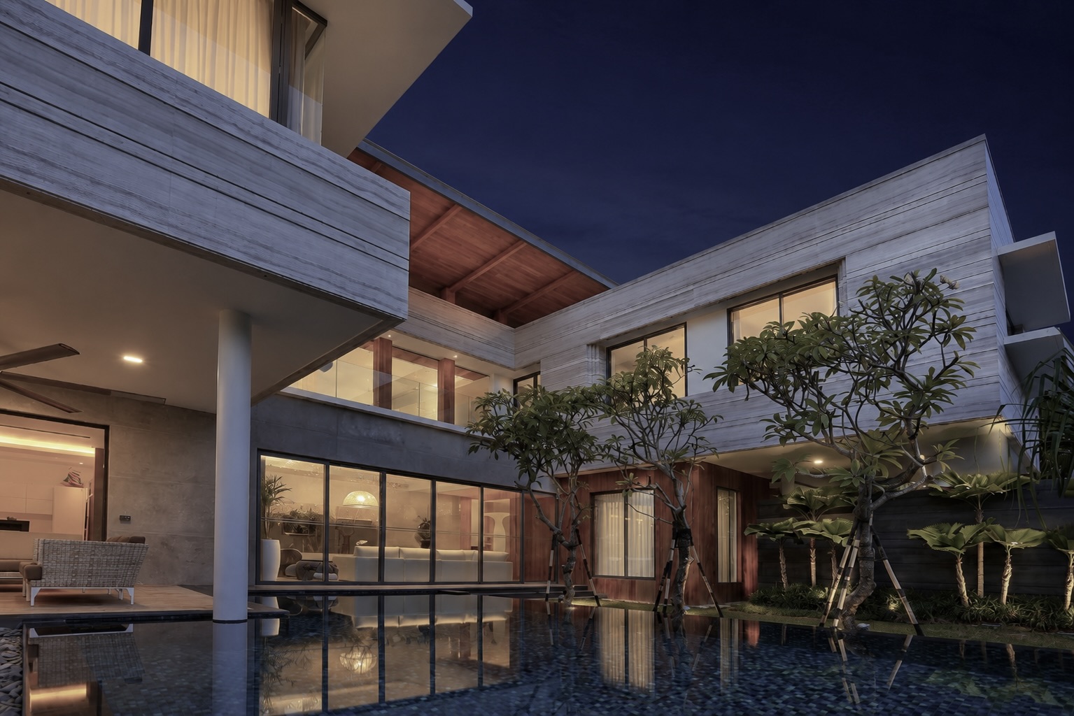 Populaire travertine courtyard residence with teal pool
